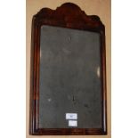 A SMALL 18TH CENTURY WALNUT WALL MIRROR, WITH SERPENTINE BREAKFRONT PEDIMENT AND ANTIQUE GLASS