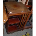 AN EDWARDIAN MAHOGANY SQUARE REVOLVING BOOKCASE