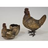 TWO EARLY 20TH CENTURY COLD PAINTED BRONZE FIGURES COMPRISING HEN AND CHICK SITTING IN A BROKEN EGG