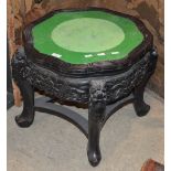 A LATE 19TH / EARLY 20TH CENTURY CHINESE EBONISED JARDINIERE STAND, THE SHAPED CIRCULAR WITH LATER