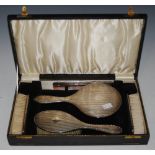 A CASED BIRMINGHAM SILVER FIVE PIECE DRESSING TABLE BRUSH AND MIRROR SET