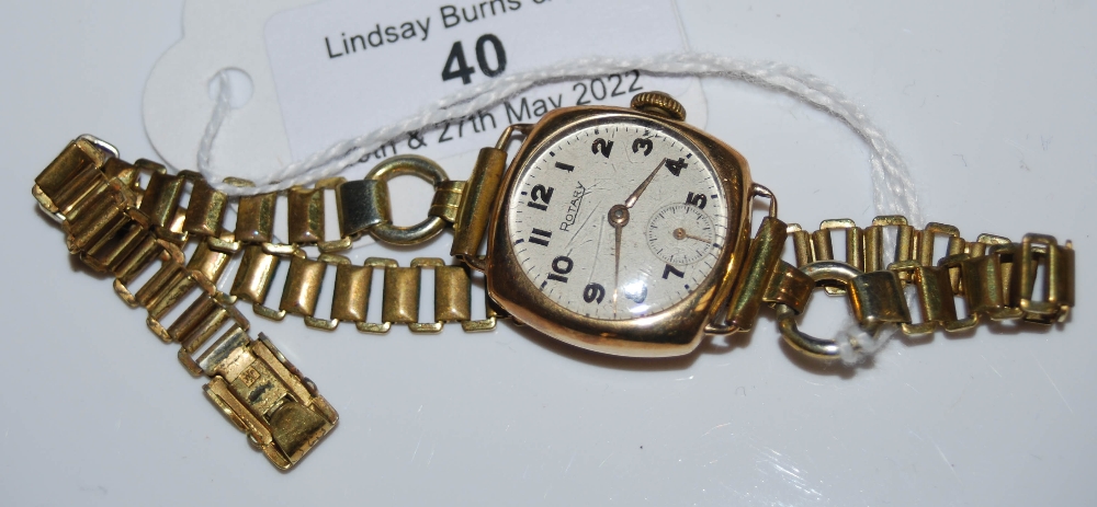 A VINTAGE 9CT GOLD CASED ROTARY WRISTWATCH WITH ARABIC NUMBERAL AND SUBSIDIARY SECONDS DIAL ON
