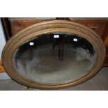 LATE 19TH CENTURY GILT WOOD OVAL BEVELLED WALL MIRROR