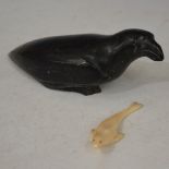 A 20TH CENTURY ALASKAN MARINE IVORY FIGURE OF A SEAL, OF ELONGATED FORM WITH INLAID EYES, THE BASE