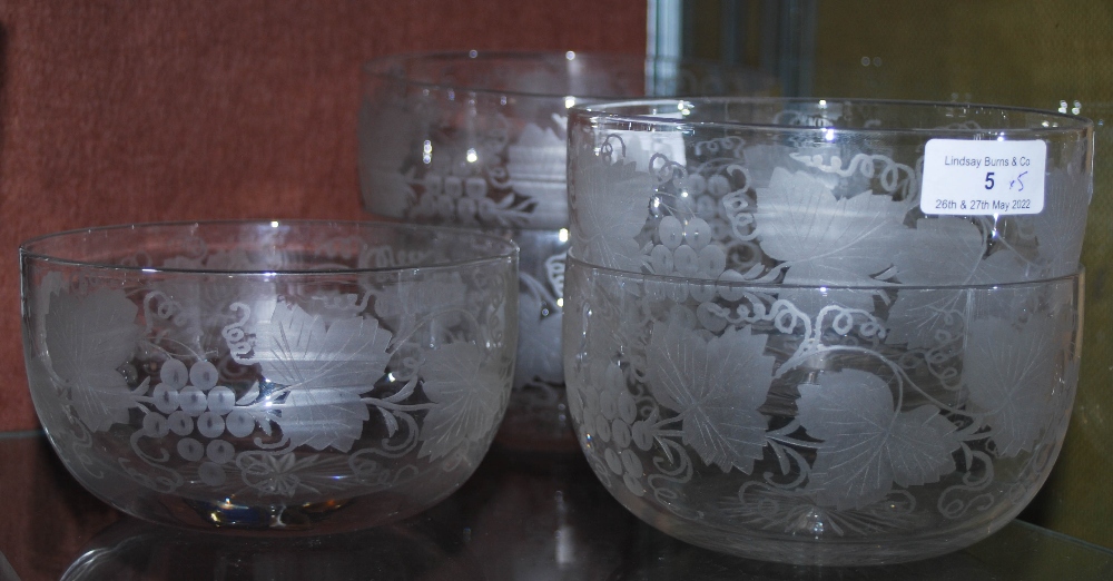 FIVE LATE 19TH / EARLY 20TH CENTURY CLEAR GLASS FINGER BOWLS WITH VINE ETCHED DECORATION