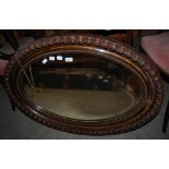 EARLY 20TH CENTURY OVAL WALL MIRROR.