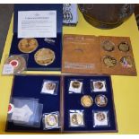 A WINDSOR MINT CASED PAIR OF GILT METAL COMMEMORATIVE MEDALLIONS TO COMMEMORATE THE 90TH BIRTHDAY OF