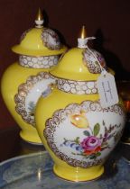 A PAIR OF LATE 19TH / EARLY 20TH CENTURY YELLOW GROUND DRESDEN PORCELAIN JARS AND COVERS,