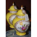 A PAIR OF LATE 19TH / EARLY 20TH CENTURY YELLOW GROUND DRESDEN PORCELAIN JARS AND COVERS,