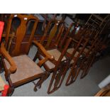 A SET OF EIGHT EARLY 20TH CENTURY OAK QUEEN ANNE STYLE DINING CHAIRS COMPRISING TWO CARVERS AND