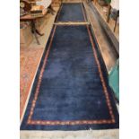 A PAIR OF BLUE GROUND PERSIAN STYLE LONG RUGS, 20TH CENTURY, THE ABRASHED BLUE GROUNDS WITH NARROW
