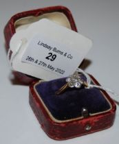 A YELLOW AND WHITE METAL DIAMOND SET CLUSTER RING, SIZE O 1/2