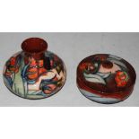 TWO PIECES OF MODERN MOORCROFT POTTERY COMPRISING SQUAT RED GROUND VASE DECORATED WITH STYLISED