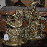 A PAIR OF BRASS PUNCH AND JUDY DOOR STOPS