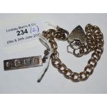 A SILVER BRACELET WITH HEART SHAPED LOCKET AND A SILVER INGOT