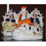 THREE 19TH CENTURY STAFFORDSHIRE FIGURES TO INCLUDE A PAIR OF LADIES WITH BEEHIVES AND ANOTHER OF