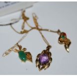 THREE ASSORTED YELLOW METAL GEM SET PENDANTS AND CHAINS