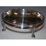 A GEORGE V SILVER BOWL, BIRMINGHAM, 1934, MAKERS MARK OF A E JONES, THE HAMMERED BOWL RAISED ON FOUR