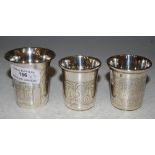 THREE 19TH CENTURY RUSSIAN SILVER VODKA CUPS, ALL STAMPED 84 ZOLOTNIK, THE LARGER CUP ENGRAVED