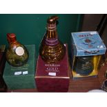 THREE BOXED WHISKY DECANTERS TO INCLUDE MACKINLAYS DELUXE SCOTCH WHISKY IN WEIGHED DECANTER, WHYTE &