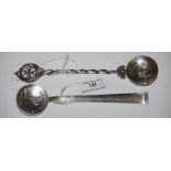TWO CONTINENTAL SILVER COIN SPOONS, ONE WITH FIVE LATI COIN BOWL THE STEM STAMPED 800, THE OTHER