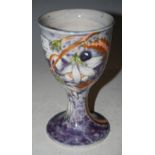 A COBRIDGE STONEWARE HAND PAINTED GOBLET DECORATED WITH FRUIT AND FLOWERS, 16.5CM HIGH