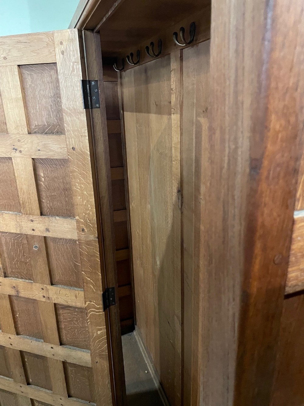 EARLY 20TH CENTURY OAK PANELLED DOUBLE WARDROBE IN THE MANNER OF THE COTSWOLD SCHOOL, THE TWO - Image 6 of 7