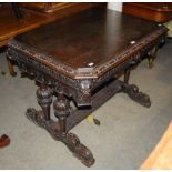 LATE 19TH/ EARLY 20TH CENTURY JACOBEAN/ ELIZABETHAN STYLE CARVED OAK TABLE OF CHAMFERED