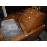 AN EARLY 20TH CENTURY BRASS MOUNTED WALNUT FUEL BIN, OF CANTED RECTANGULAR FORM, THE DOOR WITH BRASS