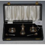 A BIRMINGHAM SILVER THREE PIECE CRUET SET IN FITTED CASE