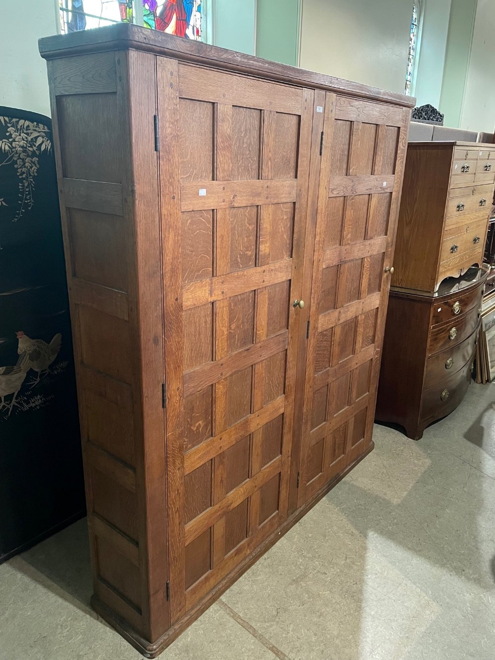 EARLY 20TH CENTURY OAK PANELLED DOUBLE WARDROBE IN THE MANNER OF THE COTSWOLD SCHOOL, THE TWO - Image 4 of 7