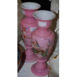 A PAIR OF VICTORIAN OPAQUE WHITE AND PINK GLASS VASES, WITH PAINTED DETAIL OF BIRD AND NEST, 24CM