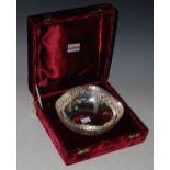 AN INDIAN WHITE METAL BOWL OF SHAPED CIRCULAR FORM IN RED VELVET FITTED BOX, 8.1 TROY OZS