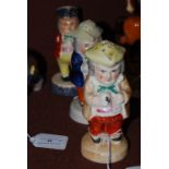 TWO 19TH CENTURY STAFFORDSHIRE POTTERY PEPPER POTS IN THE FORM OF PORTLY MALE FIGURES TO GO WITH