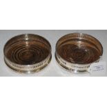 A PAIR OF SHEFFIELD SILVER BOTTLE STANDS / WINE COASTERS