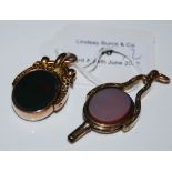 A YELLOW METAL BLOOD STONE AND AGATE OVAL FOB TOGETHER WITH ANOTHER YELLOW METAL BLOOD STONE AND