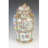 A Chinese porcelain famille rose Canton jar and cover, decorated with panels of figures, flowers and