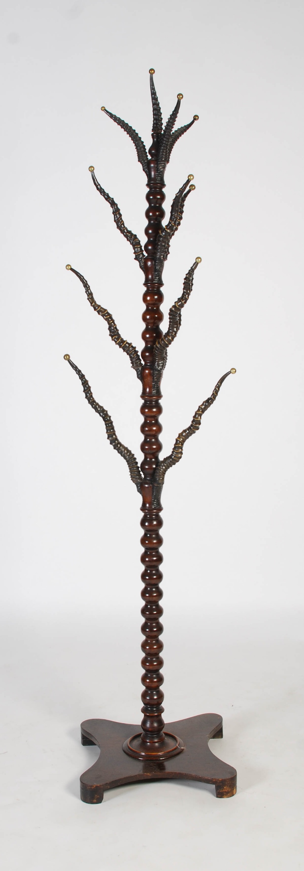 A late 19th / early 20th century turned mahogany and antelope horn mounted coat stand, the horns