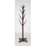 A late 19th / early 20th century turned mahogany and antelope horn mounted coat stand, the horns