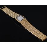 An 18ct gold Mouawad bracelet watch, the 1.7cm square dial with champagne coloured dial and baton