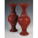 A pair of Chinese cinnabar lacquer vases, carved in shallow relief with mountain landscape of pine