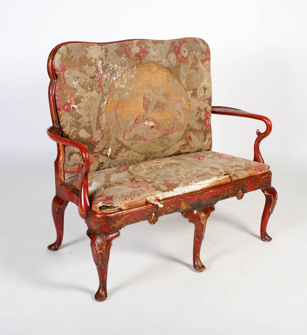 An early 20th century Queen Anne style red japanned and tapestry upholstered settee, with