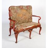 An early 20th century Queen Anne style red japanned and tapestry upholstered settee, with