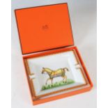 A Hermes, Paris porcelain ashtray in original fitted box, decorated with a horse wearing a yellow