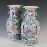 A pair of Chinese porcelain famille rose Canton vases, Qing Dynasty, decorated with rectangular