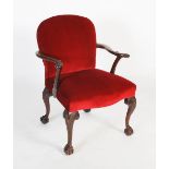 A 19th century carved mahogany armchair, the curved back with scroll arms terminating in acanthus