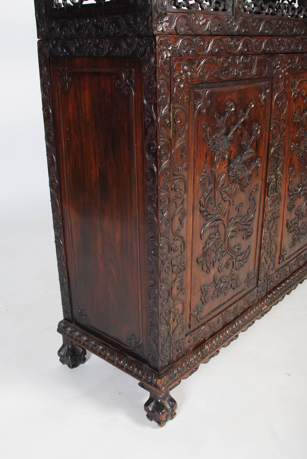 A Chinese carved darkwood display cabinet, Qing Dynasty, the arched top with a carved pediment - Image 3 of 11