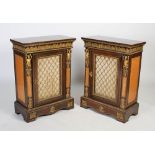 A pair of 19th century French gilt bronze mounted mahogany and satinwood pier cabinets, the