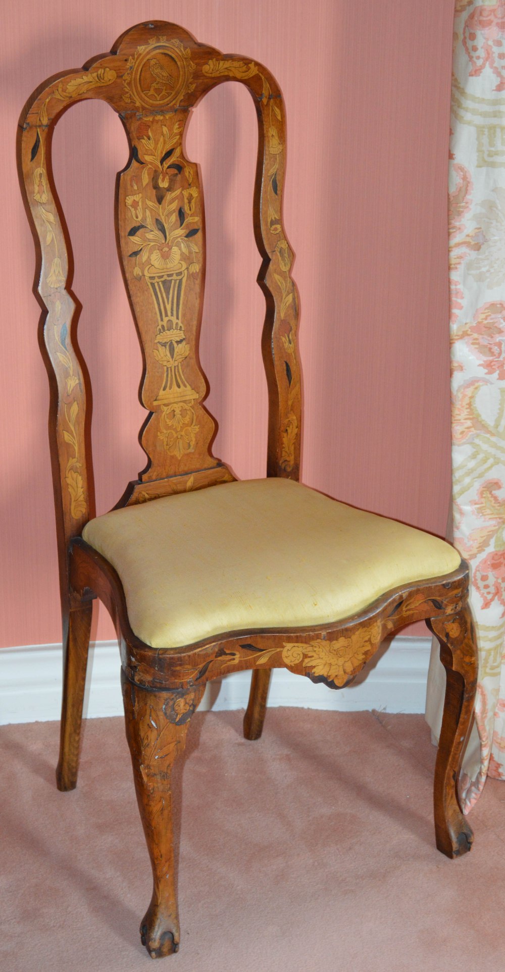 An 18th century Dutch mahogany and marquetry inlaid side chair, the vase-shaped splat inlaid with