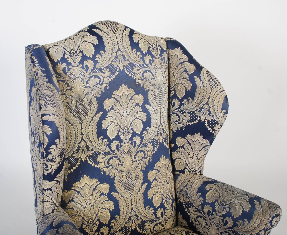 An early 20th century upholstered wingback armchair in the Georgian taste, the front carved oak legs - Image 2 of 6